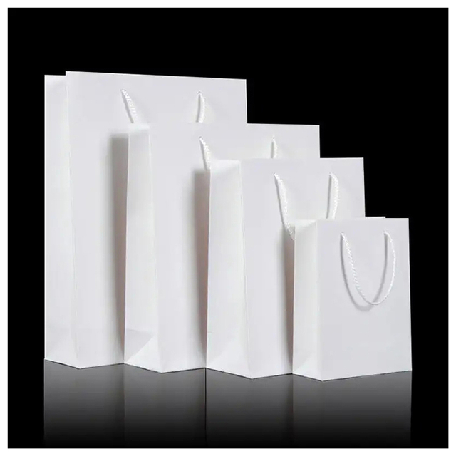 Customized Logo Gift Art Paper Shopping Bag Packaging Wholesale Kraft Paper Bag With Embossed Logo For Clothing
